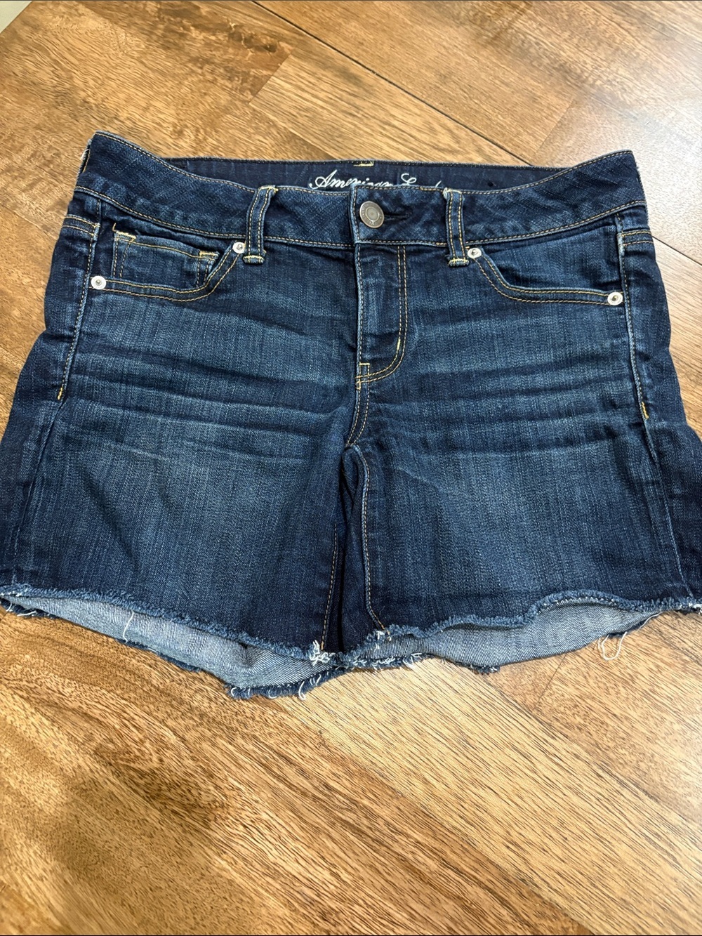 American Eagle Stretch Midi Denim Shorts size 8. Dark wash